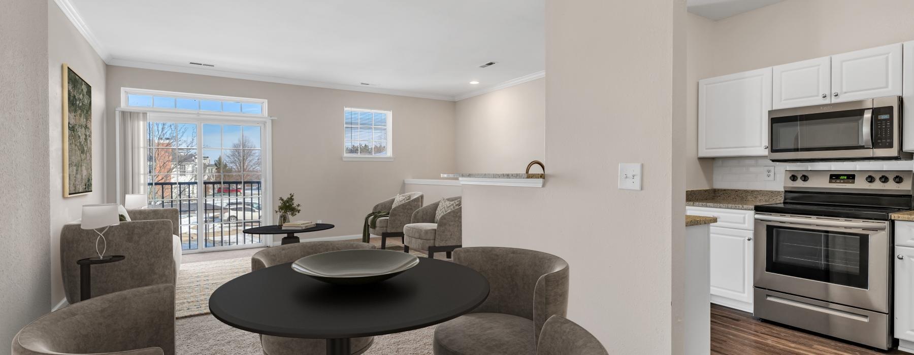 a living room with a table and chairs
