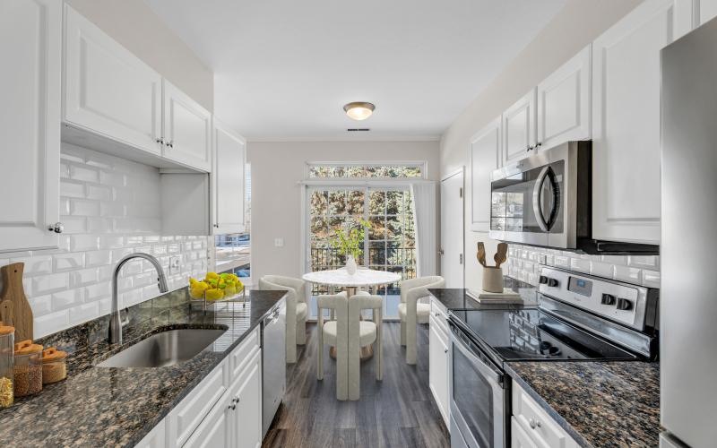 a kitchen with white cabinets