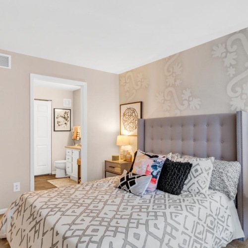 a bedroom with a bed and a coffee table