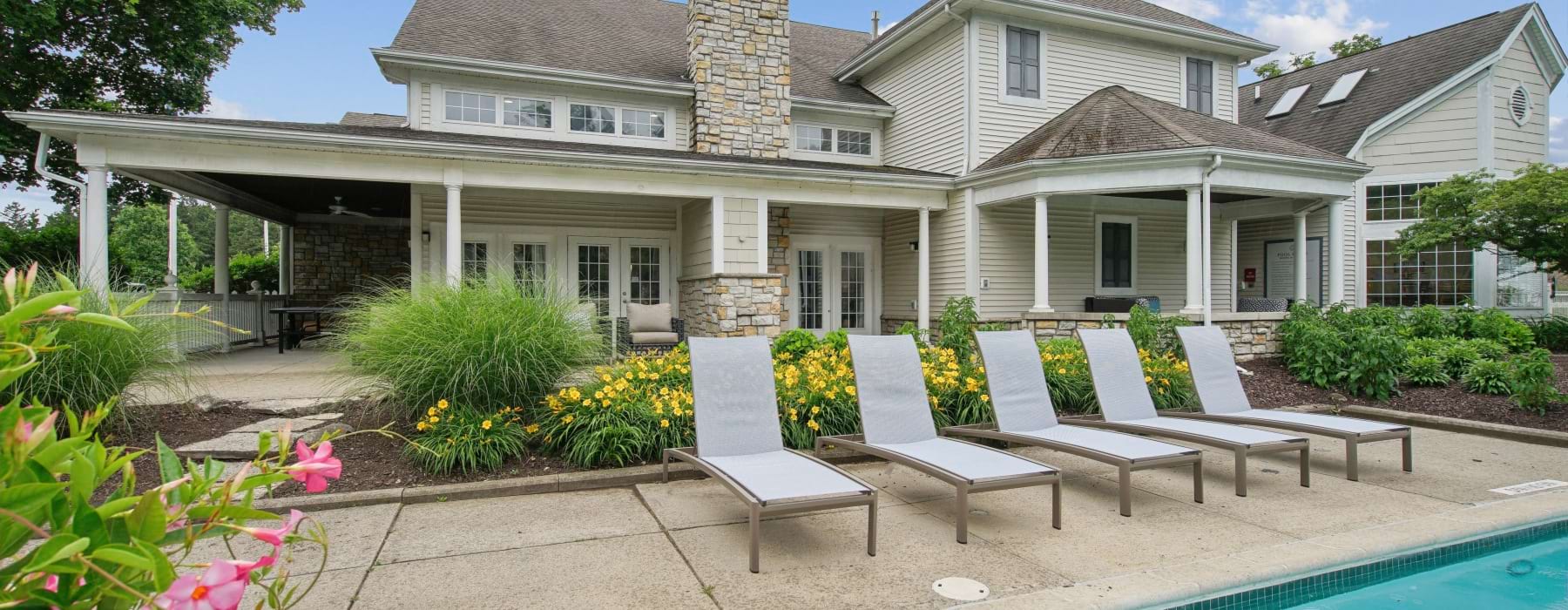 Pool deck featuring lounge chairs